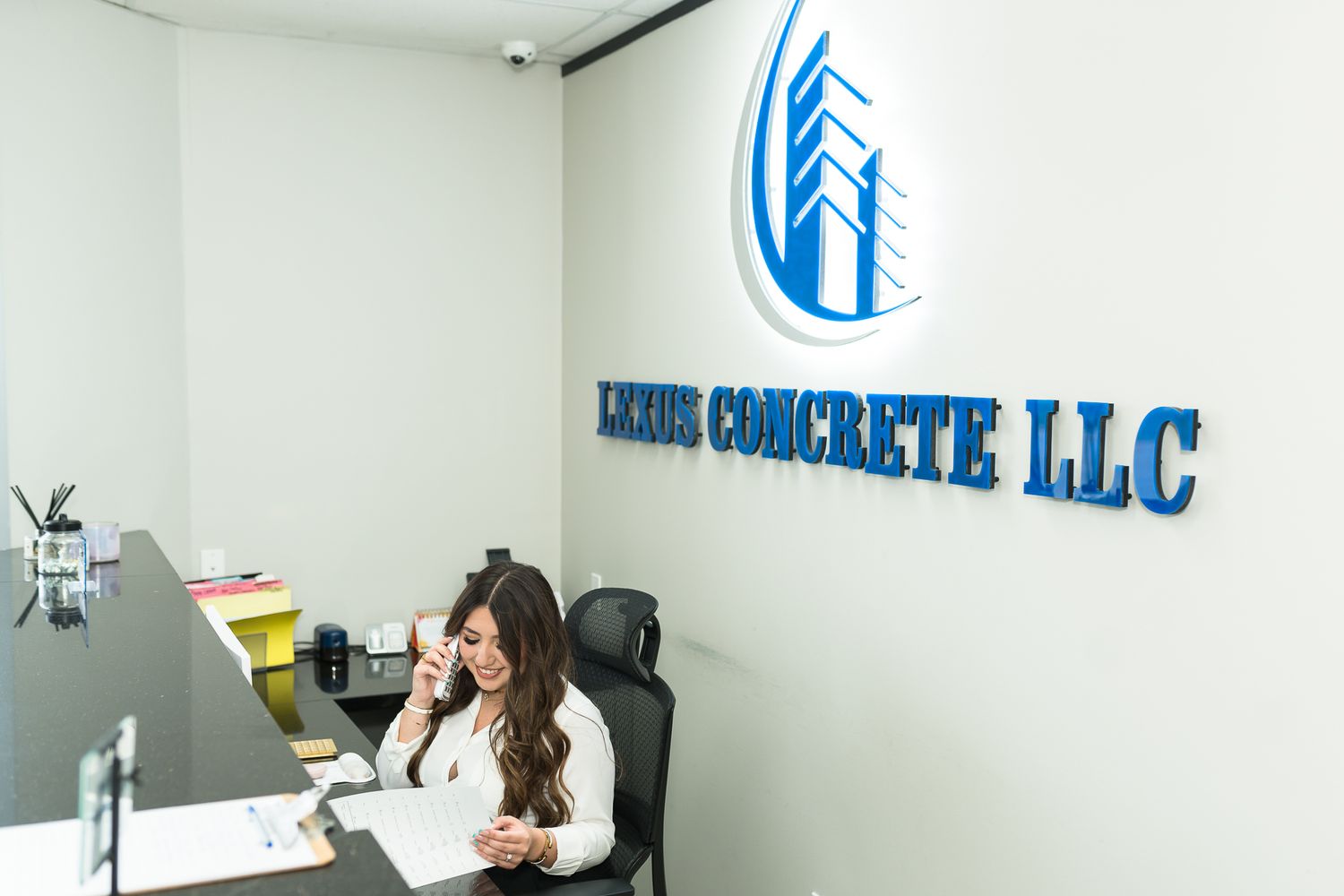 Lexus Concrete office coordinator taking a builder call in Houston, Texas